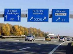 Exit signs at Autobahn crossing
